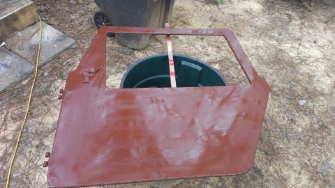 1978 Ford Bronco - A single vehicle door, possibly undergoing restoration, is shown outdoors.