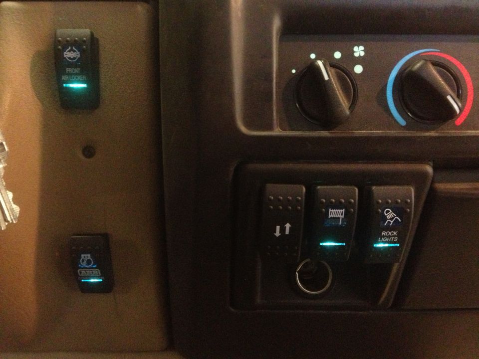Dashboard with illuminated switches for front air locker, rock lights, and other functions