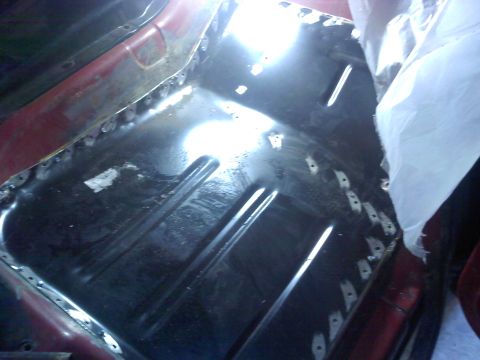 1978 Ford Bronco - Floor pan repair in progress, showing welded seams and a freshly installed metal section.