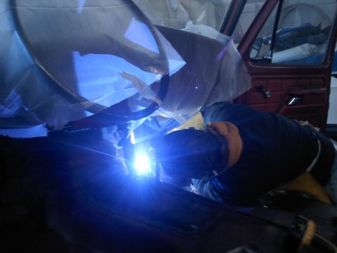 1978 Ford Bronco - Welding work is being performed inside the interior of a 1978 Ford Bronco.