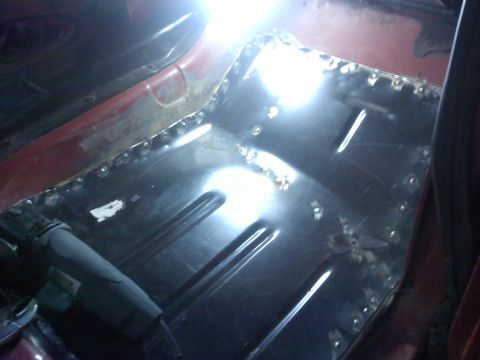 1978 Ford Bronco - Welding new metal into the floor pan of a vehicle during repair.