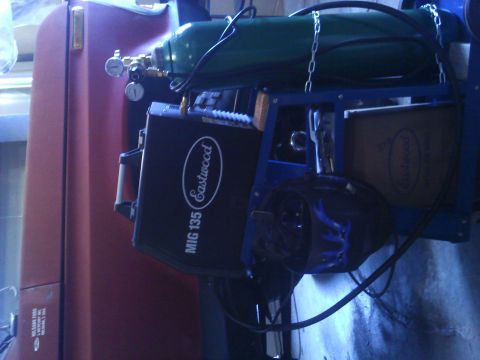 1978 Ford Bronco - A welding setup with an Eastwood MIG 135 welder and a green gas cylinder is shown.