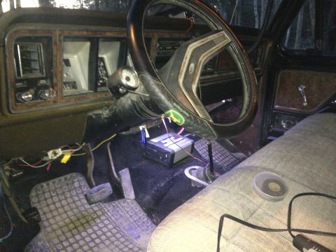 1979 Ford Bronco - The interior of an older vehicle shows exposed wiring and an aftermarket stereo unit installed.