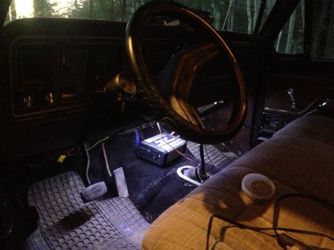 1979 Ford Bronco - The interior of a 1979 Ford Bronco shows the driver's side with aftermarket stereo components installed.