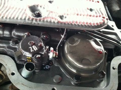 1967 Pontiac Grand Prix - A close-up view of an internal transmission component, possibly a valve body, with visible fluid and markings.