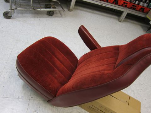 1991 Ford LTD Crown Victoria - A single car seat with corduroy-like fabric and vinyl trim is shown, resting on a box.