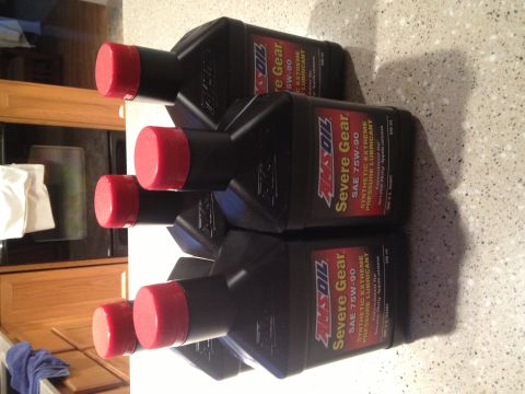 2007 Harley-Davidson Electra Glide Clsc - Several bottles of AMSOIL Severe Gear SAE 75W-90 synthetic extreme pressure lubricant are arranged on a counter.