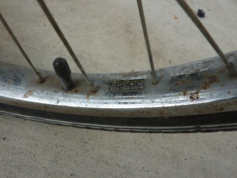 1900 Yugo GVX - A close-up view of a bicycle wheel rim, showing its construction and markings.