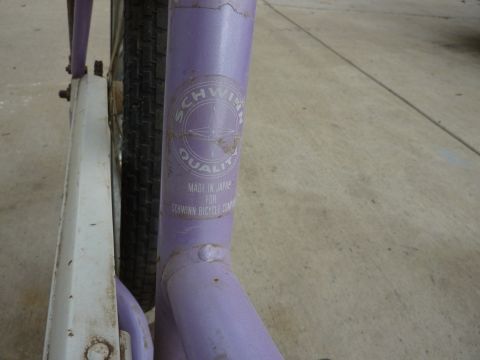 1900 Yugo GVX - Close-up of a purple bicycle frame showing the Schwinn Quality logo and manufacturing details.