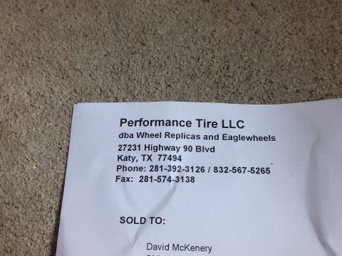 2003 Ford Crown Victoria - Photo of a Performance Tire LLC sales invoice letterhead with company address and sold-to information, not a technical document.