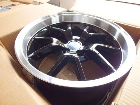 2003 Ford Crown Victoria - Black multi-spoke alloy wheel with machined lip and chrome cap angled inside a cardboard box