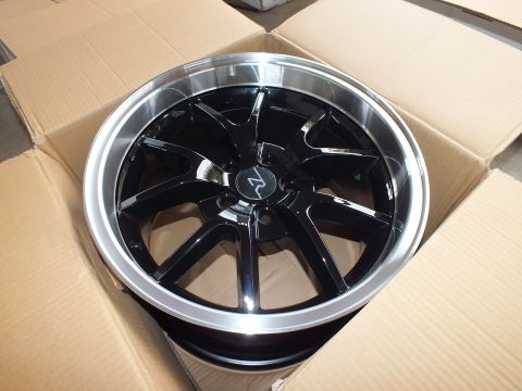 2003 Ford Crown Victoria - Five-spoke gloss black alloy wheel with polished lip and R logo cap shown in its shipping box