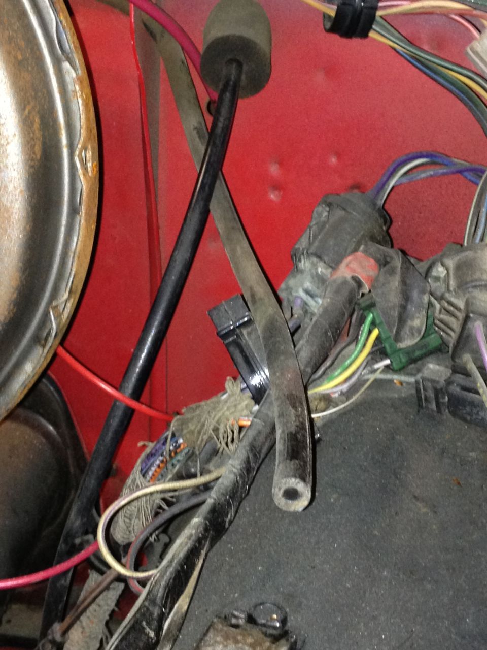 Close-up of red interior with wiring harness and black cables