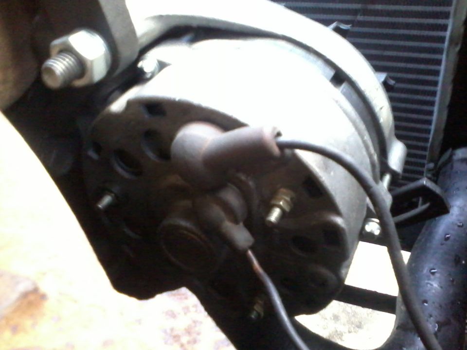 Alternator with spark plug wire attached