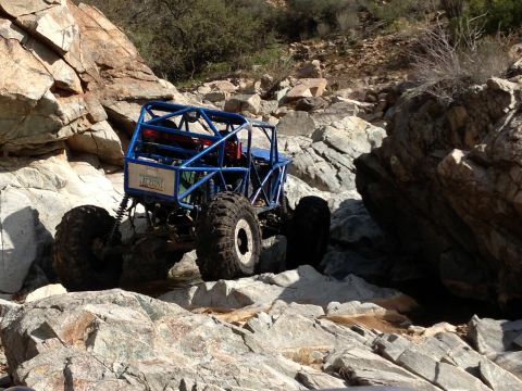 1966 Ford Bronco - A custom-built off-road buggy tackles a challenging rocky trail.