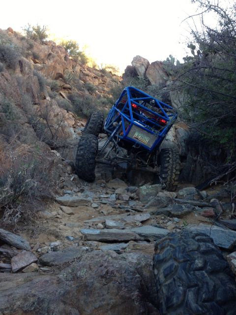 1966 Ford Bronco - A custom-built off-road buggy navigates a challenging rocky terrain.