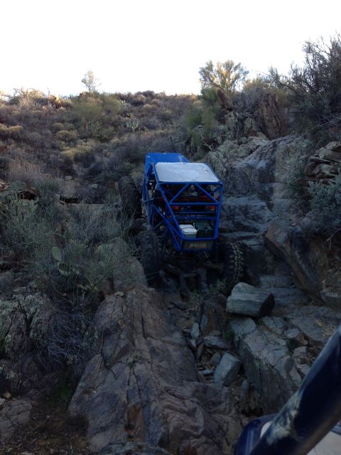1966 Ford Bronco - A custom-built off-road buggy tackles a challenging rocky trail in a desert environment.