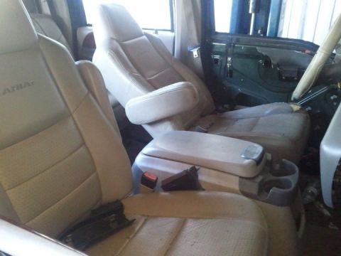 2007 Ford F-250 - Interior view of a 2007 Ford F-250, highlighting the front seats and the exposed interior of the driver's side door.