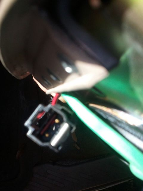 1994 Ford Bronco - A close-up view of an electrical connector with exposed wires, possibly for an airbag system.