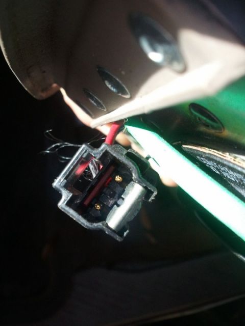 1994 Ford Bronco - Close-up of an electrical connector with visible wiring and metal contacts.