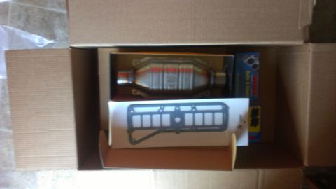 1990 Ford Bronco - New parts in a box: catalytic converter and gasket.