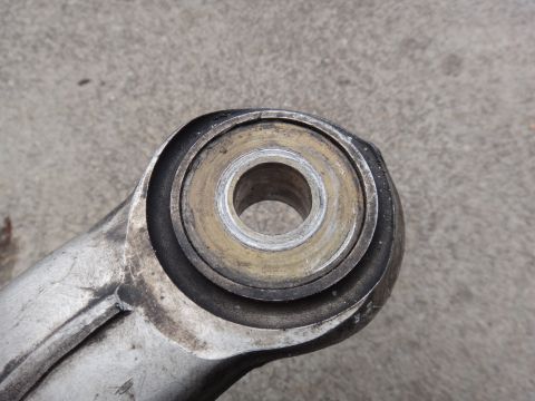 2000 Lincoln Continental - A worn suspension bushing, likely needing replacement, is shown in a close-up view.