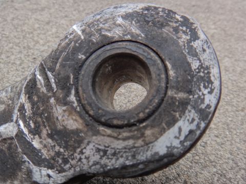 2000 Lincoln Continental - Worn suspension bushing, likely needing replacement due to visible wear and tear.