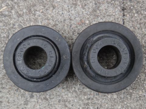 2000 Lincoln Continental - Close-up of two rubber suspension bushings, each showing part numbers.
