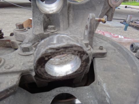 2000 Lincoln Continental - Dirty suspension part with visible bearing surfaces and mounting bolts.