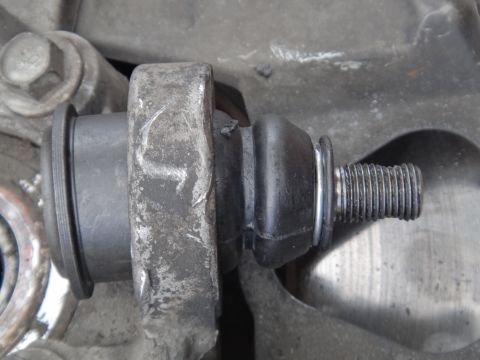 2000 Lincoln Continental - This is a close-up view of a vehicle's ball joint, a critical component of the suspension system.