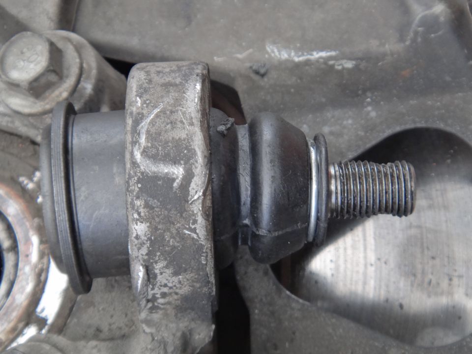 Close-up of a ball joint with a threaded stud