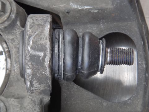 2000 Lincoln Continental - A detailed view of a vehicle's suspension system, focusing on a single component.