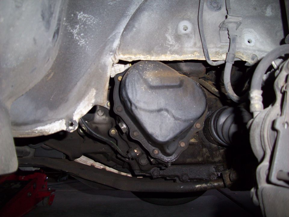 Transmission and CV axle boot on underside of vehicle