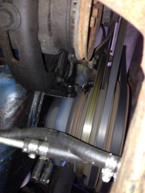 1979 Ford Bronco - Close-up view of engine belt pulleys and associated components.