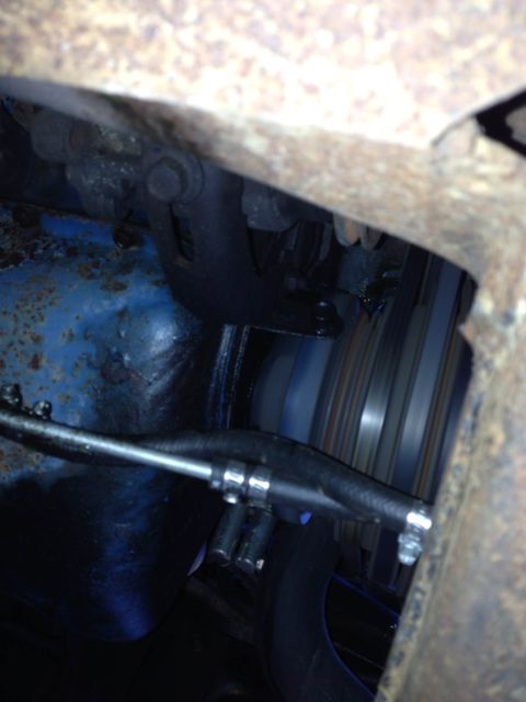 1979 Ford Bronco - Close-up view of an engine's belt and pulley system, showing mechanical components.