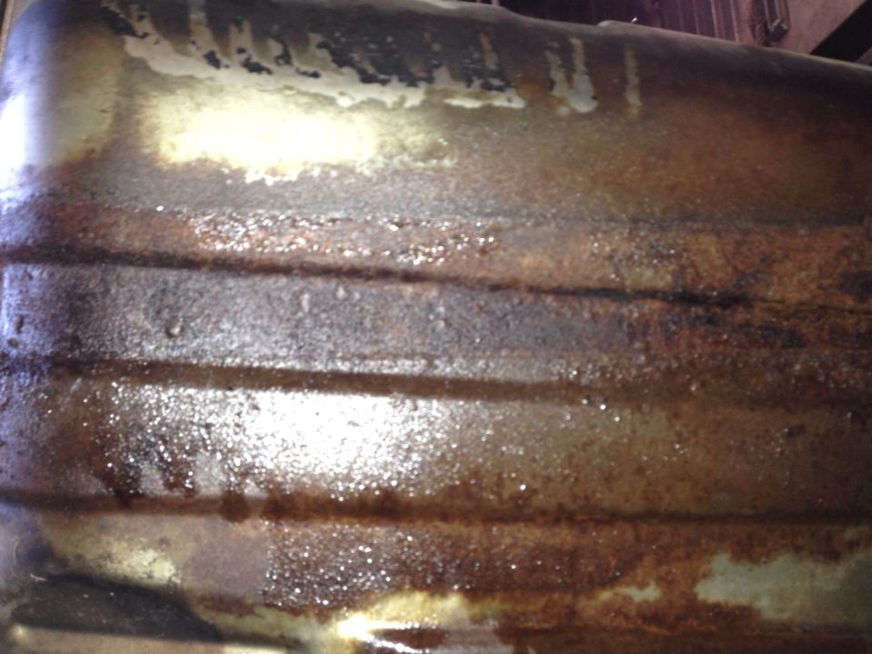 rusted metal part with horizontal ridges