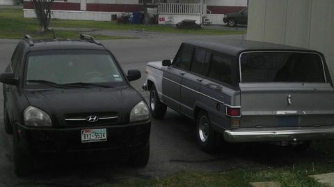 1982 Jeep Wagoneer - A 1982 Jeep Wagoneer is parked next to a black Hyundai Tucson.