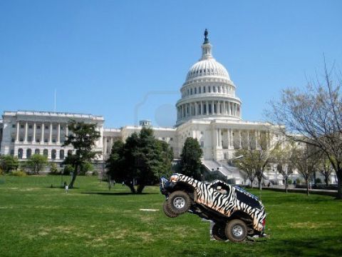 2007 Ford F-250 - A custom-painted off-road vehicle performs a stunt on the National Mall with the U.S. Capitol building in the background.