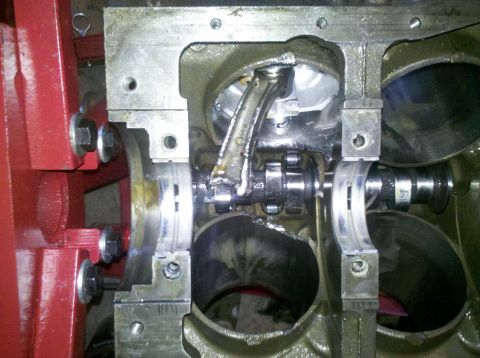 1996 Ford Bronco - Internal engine damage is evident, with a broken connecting rod and severely worn crankshaft bearings visible.