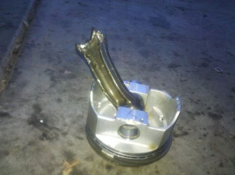 1996 Ford Bronco - This damaged engine part shows significant internal failure.