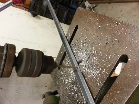 1978 Ford Bronco - Drill press in action, cutting metal and producing shavings.