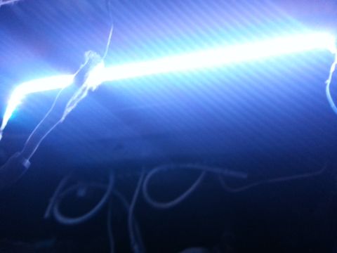 1978 Ford Bronco - Blue underbody light bar with visible wiring and a Supermotors logo in the corner.