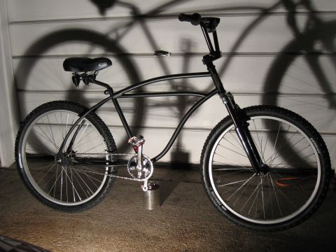 1994 Ford Bronco - A custom black cruiser bicycle is shown with its shadow cast on a garage door.