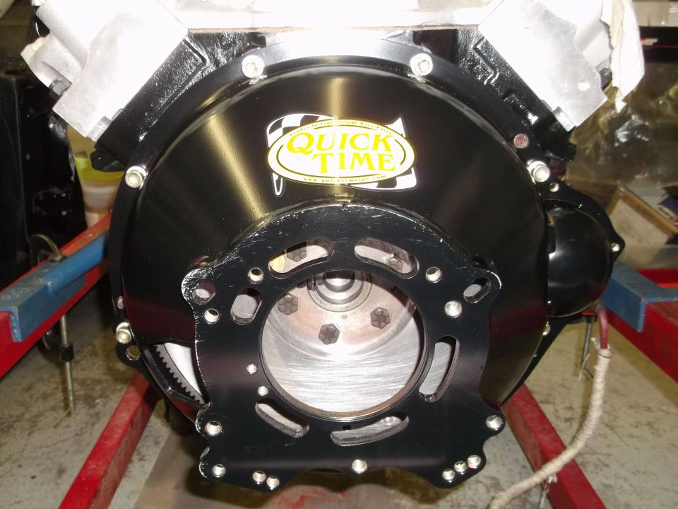 Black Quick Time bell housing on engine block, bolted to a stand