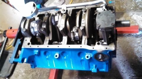 1977 Ford F-150 - Close-up view of an engine block assembly, showing the crankshaft and connecting rods.