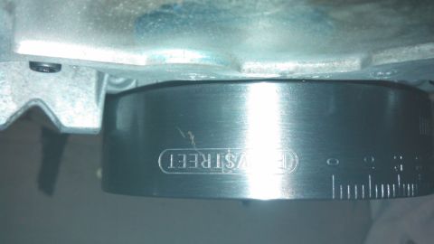 1977 Ford F-150 - Close-up of an engine part showing 'EV STREET' and a scale with markings.