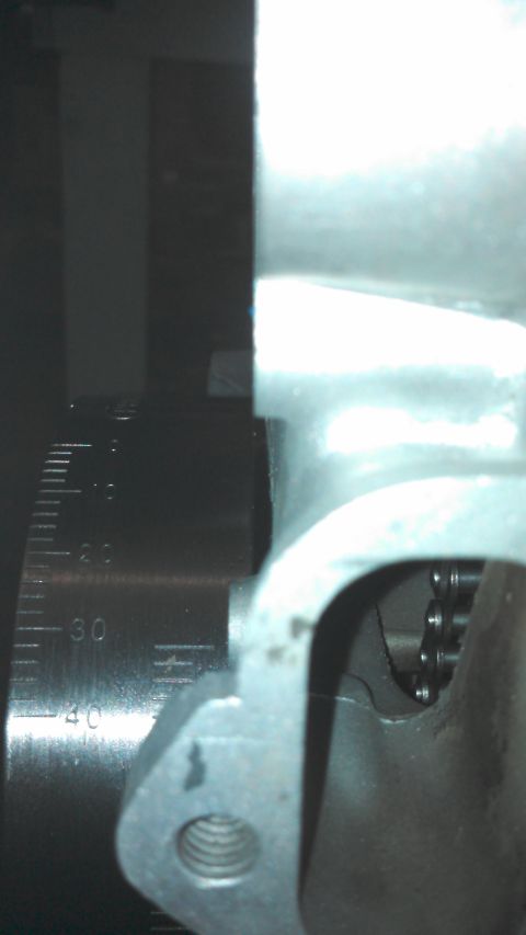 1977 Ford F-150 - A close-up view shows an engine's timing chain and gear mechanism, with a visible measurement scale.