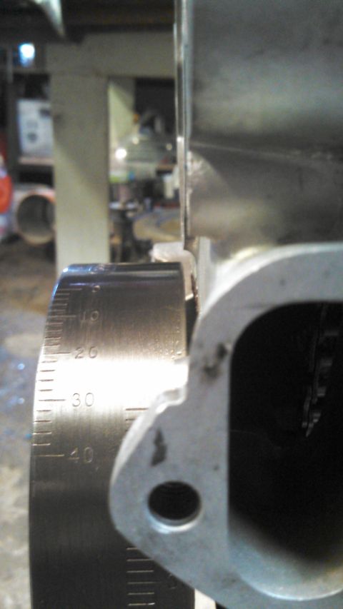 1977 Ford F-150 - Close-up of an engine component with a graduated scale for precise measurement.