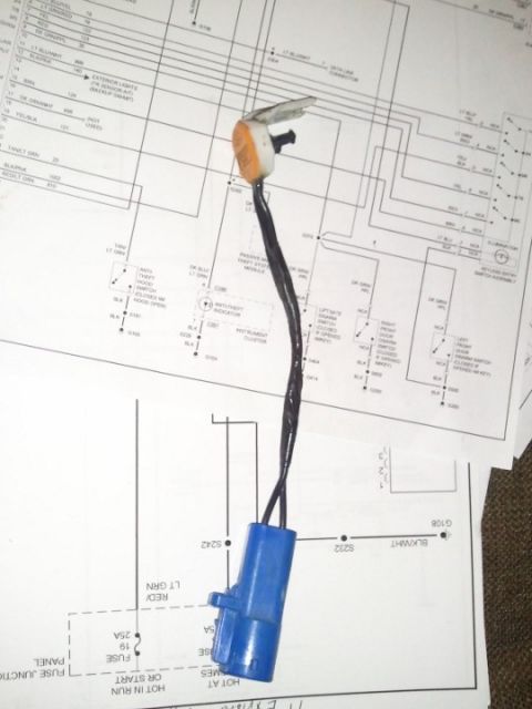1994 Ford Bronco - Wiring diagram showing color-coded circuits and fuse junction panel connections with a connector laid over the page.
