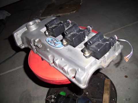 1995 Ford Probe - A silver Ford valve cover with ignition coils is shown, likely from an engine.